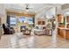 Inviting living room with fireplace, stylish furniture, and large windows at 5129 S Tom Bay Rd, Bennett, CO 80102