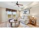 Bright living room with comfortable seating and plenty of natural light at 5129 S Tom Bay Rd, Bennett, CO 80102