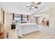 Spacious main bedroom suite featuring large windows and comfortable furnishings at 5129 S Tom Bay Rd, Bennett, CO 80102