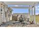 Covered patio with outdoor dining and barbeque area at 5129 S Tom Bay Rd, Bennett, CO 80102