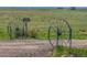Wheel monuments decorate the entrance to the property at 5129 S Tom Bay Rd, Bennett, CO 80102