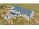 Ranch-style home with a backyard entertainment space, patio, fountain, and pergola-covered seating area at 5129 S Tom Bay Rd, Bennett, CO 80102