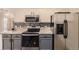 Updated kitchen featuring stainless steel appliances and granite countertops at 22520 E Ontario Dr # 101, Aurora, CO 80016