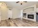 Spacious living room featuring modern floors, a decorative fireplace, and a seamless transition to the kitchen at 22520 E Ontario Dr # 101, Aurora, CO 80016