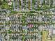 Overhead view of a well-maintained residential neighborhood with tree-lined streets and community green spaces at 5225 E 100Th Dr, Thornton, CO 80229