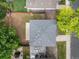 Aerial view of a private backyard with green grass, a patio, and mature trees at 5225 E 100Th Dr, Thornton, CO 80229