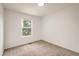 A cozy room with plush carpet and a bright window offering natural light and outside views at 5225 E 100Th Dr, Thornton, CO 80229