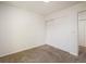 This bedroom features plush carpets and a sliding closet with ample storage space at 5225 E 100Th Dr, Thornton, CO 80229
