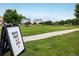 Well-manicured community park with grassy fields and movie night announcement at 5225 E 100Th Dr, Thornton, CO 80229