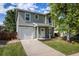 Charming two-story home with a well-maintained lawn and attached one car garage at 5225 E 100Th Dr, Thornton, CO 80229
