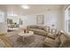 Spacious living room with modern decor, hardwood floors, comfortable seating, and open dining area at 5225 E 100Th Dr, Thornton, CO 80229