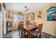 Cozy dining room featuring a wooden table with six chairs at 3937 W Grand Ave, Littleton, CO 80123
