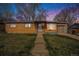 Charming brick home with a well-maintained lawn and attached garage at 3937 W Grand Ave, Littleton, CO 80123