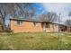 Charming brick home with a well-maintained lawn and attached garage at 3937 W Grand Ave, Littleton, CO 80123