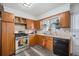 Functional kitchen with stainless steel appliances and updated cabinets at 3937 W Grand Ave, Littleton, CO 80123