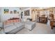 Open living space with a gray sectional sofa open to the dining area at 3937 W Grand Ave, Littleton, CO 80123