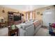 Cozy living room featuring a comfortable gray sectional and an entertainment center at 3937 W Grand Ave, Littleton, CO 80123