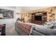Comfortable living room with a gray sectional sofa adjacent to the dining room at 3937 W Grand Ave, Littleton, CO 80123