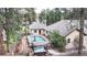 A private backyard featuring a hot tub, pool, and patio areas at 4456 Mohawk Dr, Larkspur, CO 80118