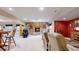 Cozy basement with stone fireplace, seating area, game table, and rustic decor at 4456 Mohawk Dr, Larkspur, CO 80118