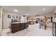 Basement featuring a living area, stone fireplace, seating, and game area at 4456 Mohawk Dr, Larkspur, CO 80118