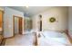 Bright bathroom featuring a tub, walk-in shower, and a neutral tile design at 4456 Mohawk Dr, Larkspur, CO 80118