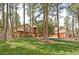 Spacious home with well-manicured lawn and tall trees at 4456 Mohawk Dr, Larkspur, CO 80118
