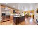 Open kitchen layout with granite countertops, stainless steel appliances, and a large island for entertaining at 4456 Mohawk Dr, Larkspur, CO 80118