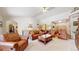 Spacious living room with high ceilings, a fireplace, and an open floor plan at 4456 Mohawk Dr, Larkspur, CO 80118