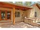 An outdoor kitchen featuring a built-in grill and stylish accents at 4456 Mohawk Dr, Larkspur, CO 80118