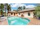 A refreshing pool nestled next to an outdoor living area, perfect for enjoying sunny days at 4456 Mohawk Dr, Larkspur, CO 80118