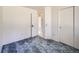 Bright bedroom featuring blue patterned carpeting and neutral walls at 7329 S Jay St, Littleton, CO 80128