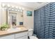 Well-lit bathroom with a vanity and a shower-tub combo with a curtain at 601 W 11Th Ave # 409, Denver, CO 80204