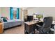 Comfortable bedroom featuring a work area and a window at 601 W 11Th Ave # 409, Denver, CO 80204