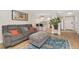 Open-concept living room with seating area and a stylish kitchen at 601 W 11Th Ave # 409, Denver, CO 80204