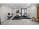 Basement gym with treadmill, rowing machine, weight rack, rubber flooring, and sauna for ultimate fitness at 5625 Heritage Oak Dr, Parker, CO 80134
