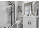 Bright bathroom featuring a glass-enclosed shower, modern vanity, and sleek fixtures at 5625 Heritage Oak Dr, Parker, CO 80134