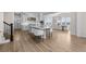 Bright kitchen with large center island, modern appliances, and adjacent dining area at 5625 Heritage Oak Dr, Parker, CO 80134