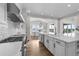 Bright and spacious kitchen with a large island, stainless steel appliances, and open dining area at 5625 Heritage Oak Dr, Parker, CO 80134