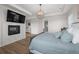 Main bedroom with fireplace, chandelier, and TV at 5625 Heritage Oak Dr, Parker, CO 80134