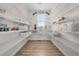 Walk-in pantry with wire shelving, hardwood floors, and a window for natural light at 5625 Heritage Oak Dr, Parker, CO 80134