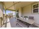 Relax on the covered back deck, perfect for enjoying outdoor meals and gatherings at 14437 Grape St, Thornton, CO 80602