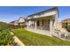 Expansive backyard with a covered patio perfect for outdoor gatherings at 14437 Grape St, Thornton, CO 80602