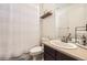 Cozy bathroom featuring neutral colors, a toilet, a vanity sink and shower at 14437 Grape St, Thornton, CO 80602
