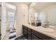 Bathroom featuring a dual vanity and a view of the toilet room at 14437 Grape St, Thornton, CO 80602