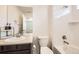 Bathroom featuring a vanity, white tiling in the shower, and neutral color scheme at 14437 Grape St, Thornton, CO 80602