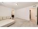 Spacious bedroom with soft carpeting and easy access to an attached bathroom at 14437 Grape St, Thornton, CO 80602
