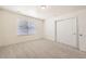 Spacious bedroom featuring neutral walls, carpeted floor, and a window for natural light at 14437 Grape St, Thornton, CO 80602