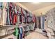 Spacious walk-in closet with ample storage and clothing organization at 14437 Grape St, Thornton, CO 80602
