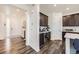Stylish entryway showcasing modern finishes and seamless transition to the kitchen and living areas at 14437 Grape St, Thornton, CO 80602
